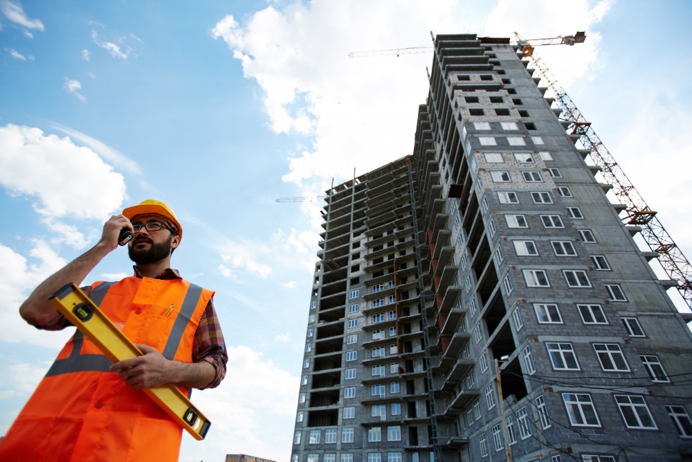 A civil engineer in front of a building